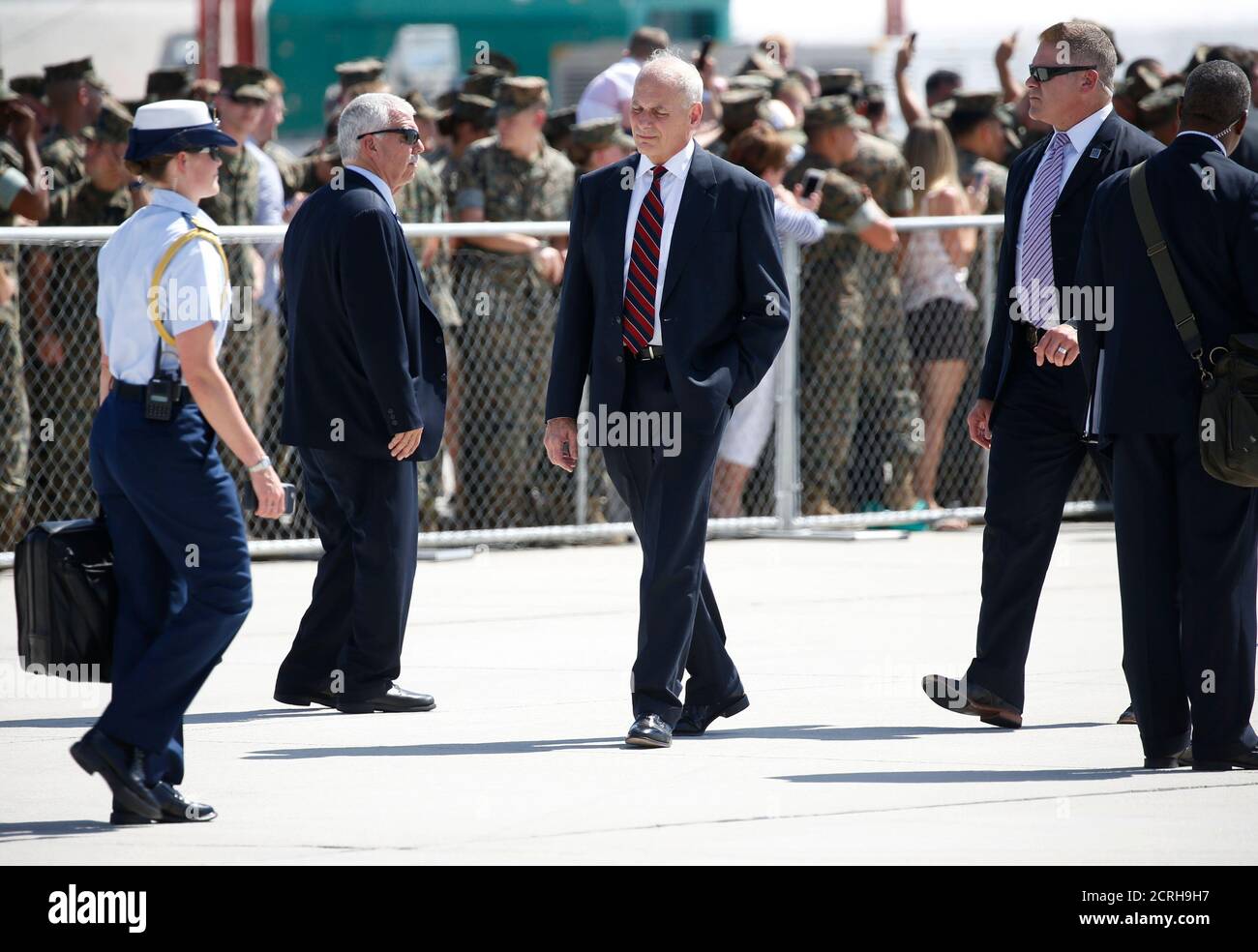 White House Chief of Staff John Kelly (C) walks at Marine Corps Air Station Yuma during U.S. President Donald Trump stop in Yuma, Arizona, U.S., August 22, 2017. REUTERS/Joshua Roberts Stock Photo