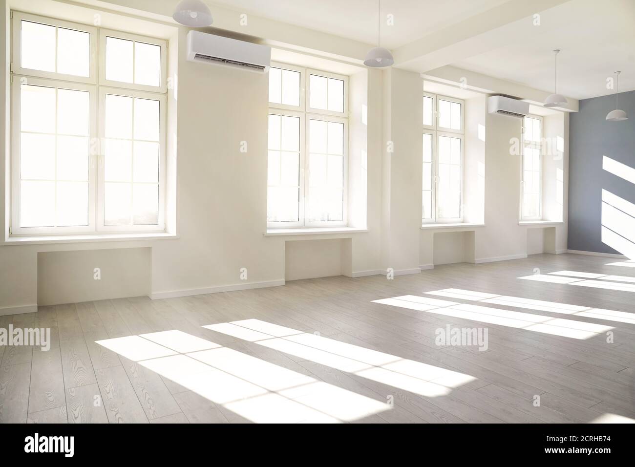 Empty light white room with window with sunlight. Stock Photo