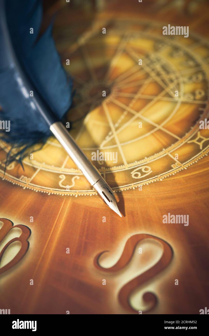 astrology chart with all zodiac signs and blue quill Stock Photo