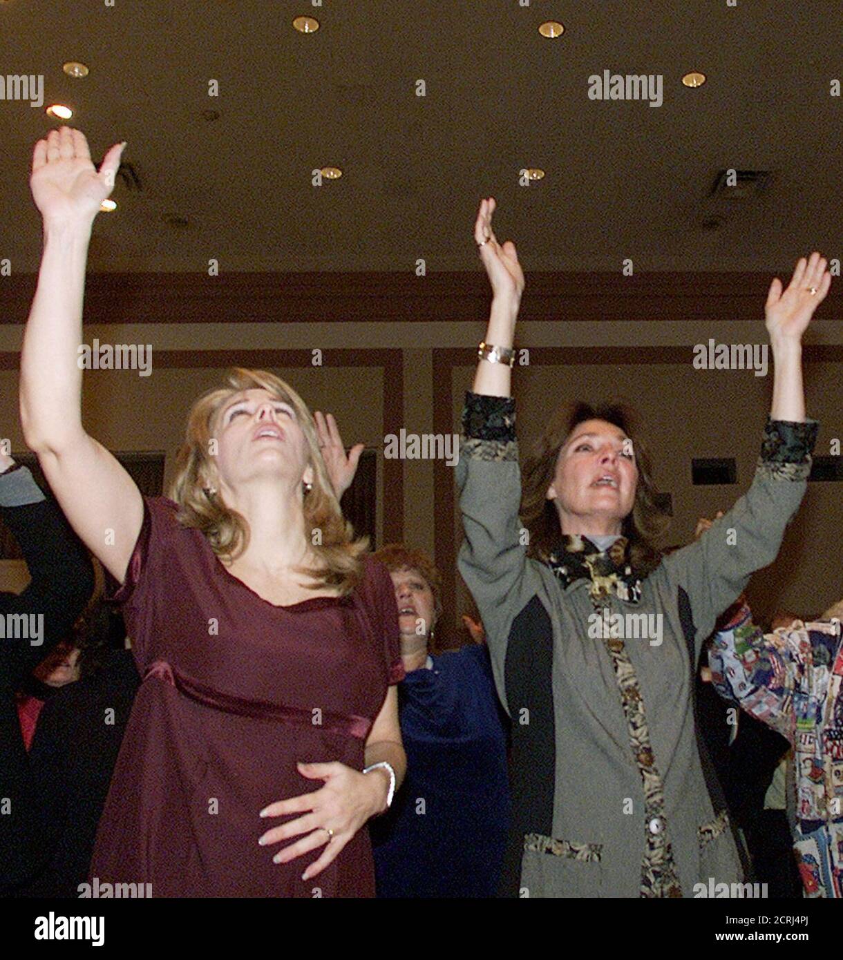 Actress and author Jennifer O'Neil (R) sings next to an unidentified woman during an anti-abortion event on Capitol Hill in Washington held by The National Pro-life Religious Council, January 22, 2003. Activists on both sides of the abortion debate rallied on Wednesday to mark the 30th anniversary of the U.S. Supreme Court ruling Roe v. Wade legalizing abortion. REUTERS/Brendan McDermid Stock Photo