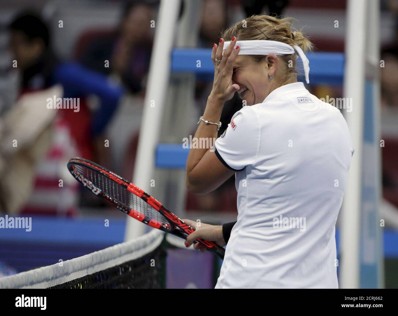 Timea Bacsinszky of Switzerland reacts after beating Ana Ivanovic of