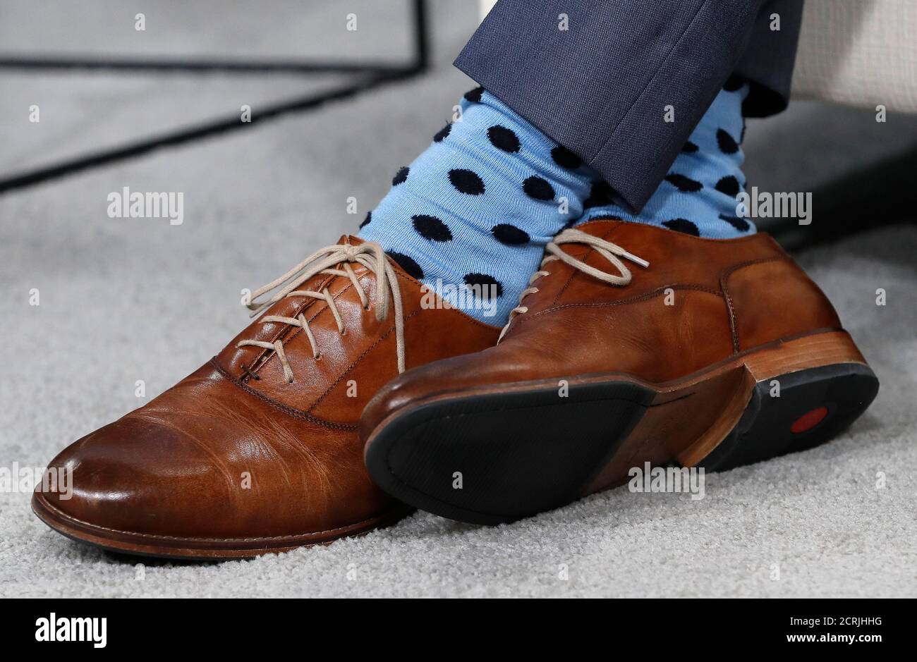 The shoes and socks of Canadian Prime Minister Justin Trudeau are seen  during a meeting with Argentina's President Mauricio Macri at a G7 Summit  in the Charlevoix town of La Malbaie, Quebec,