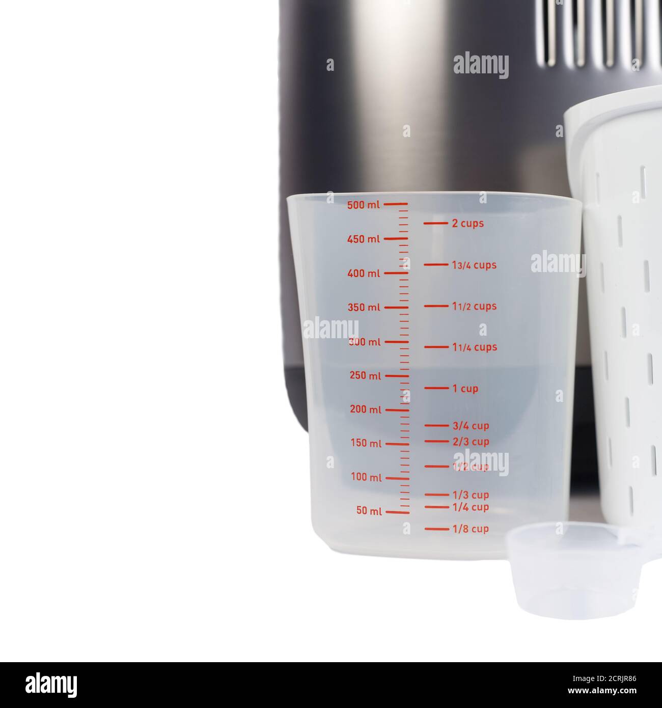 Bread maker accessories isolated on white background. Plastic measuring