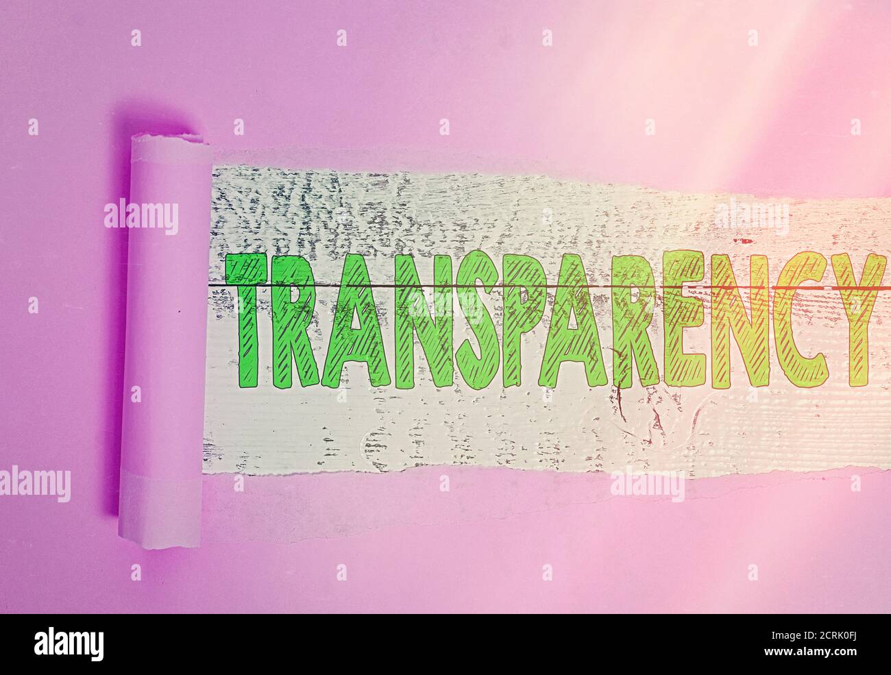Text sign showing Transparency. Business photo showcasing something transparent especially a picture viewed by light Rolled ripped torn cardboard plac Stock Photo