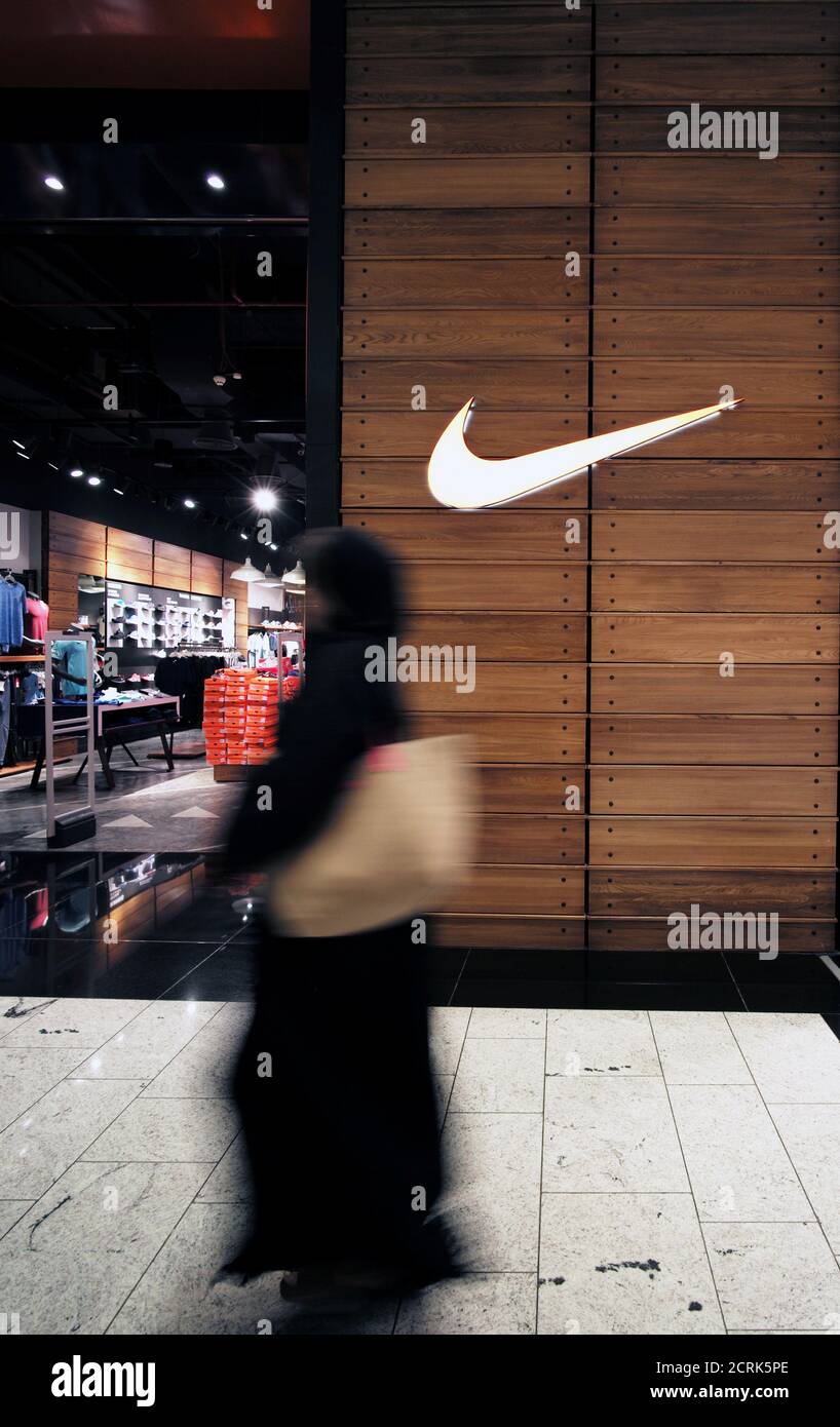 Local woman is seen walking in front of the Nike store at Bahrain City  Center in Manama, Bahrain September 17, 2017. REUTERS/Hamad I Mohammed  Stock Photo - Alamy