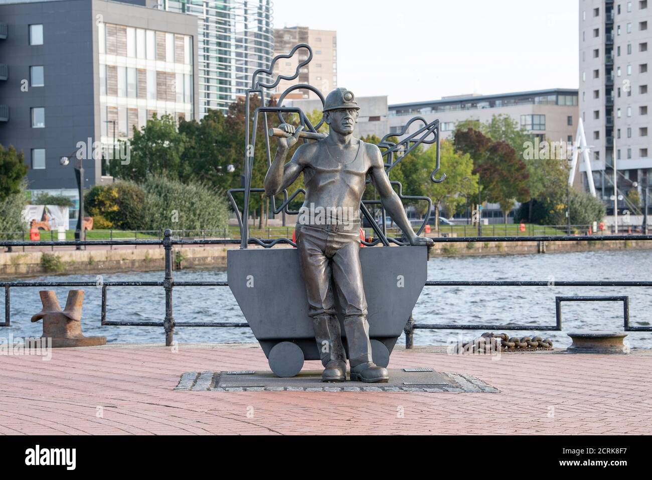 From Pit to Port, bronze statue of a Welsh coal miner, by John Clinch, Cardiff Bay, Cardiff, Wales, United Kingdom. Stock Photo