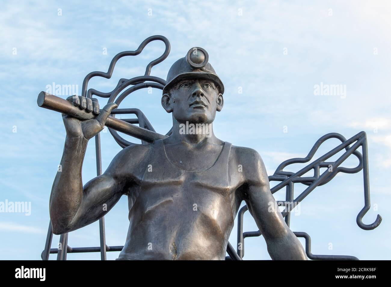 From Pit to Port, bronze statue of a Welsh coal miner, by John Clinch, Cardiff Bay, Cardiff, Wales, United Kingdom. Stock Photo