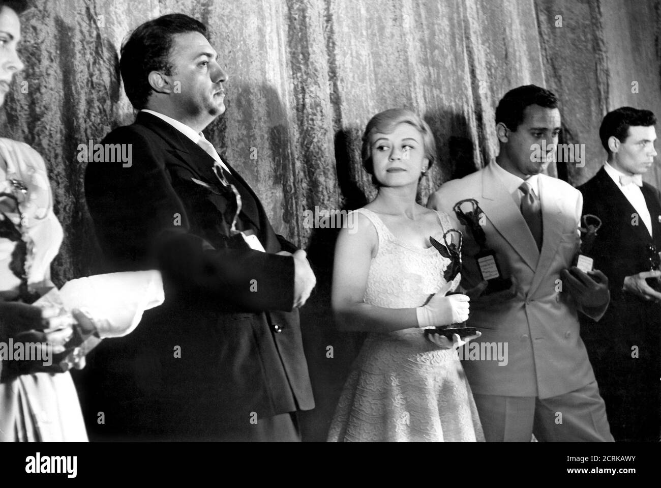 In the photo: the 'Cinematographic Victories 1955' were assigned to the best Italian actors and directors who were most liked by the public at the IV Fontane theater. of the winners are present: Giulietta MASINA, Federico FELLINI, Alberto SORDI, was also present at the Valentina CORTESE event, Rome, 4 july 1955. Stock Photo