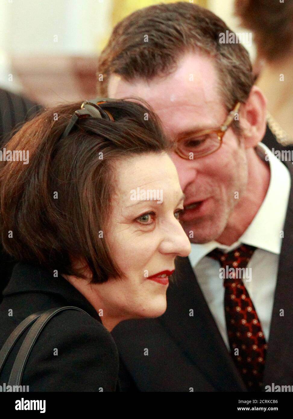 German actor Ulrich Matthes (R) talks with writer and Nobel Prize laureate Herta Mueller after she received the Great Cross of Merit with Star at Bellevue Castle in Berlin May 6, 2010.   REUTERS/Thomas Peter  (GERMANY - Tags: ENTERTAINMENT POLITICS) Stock Photo