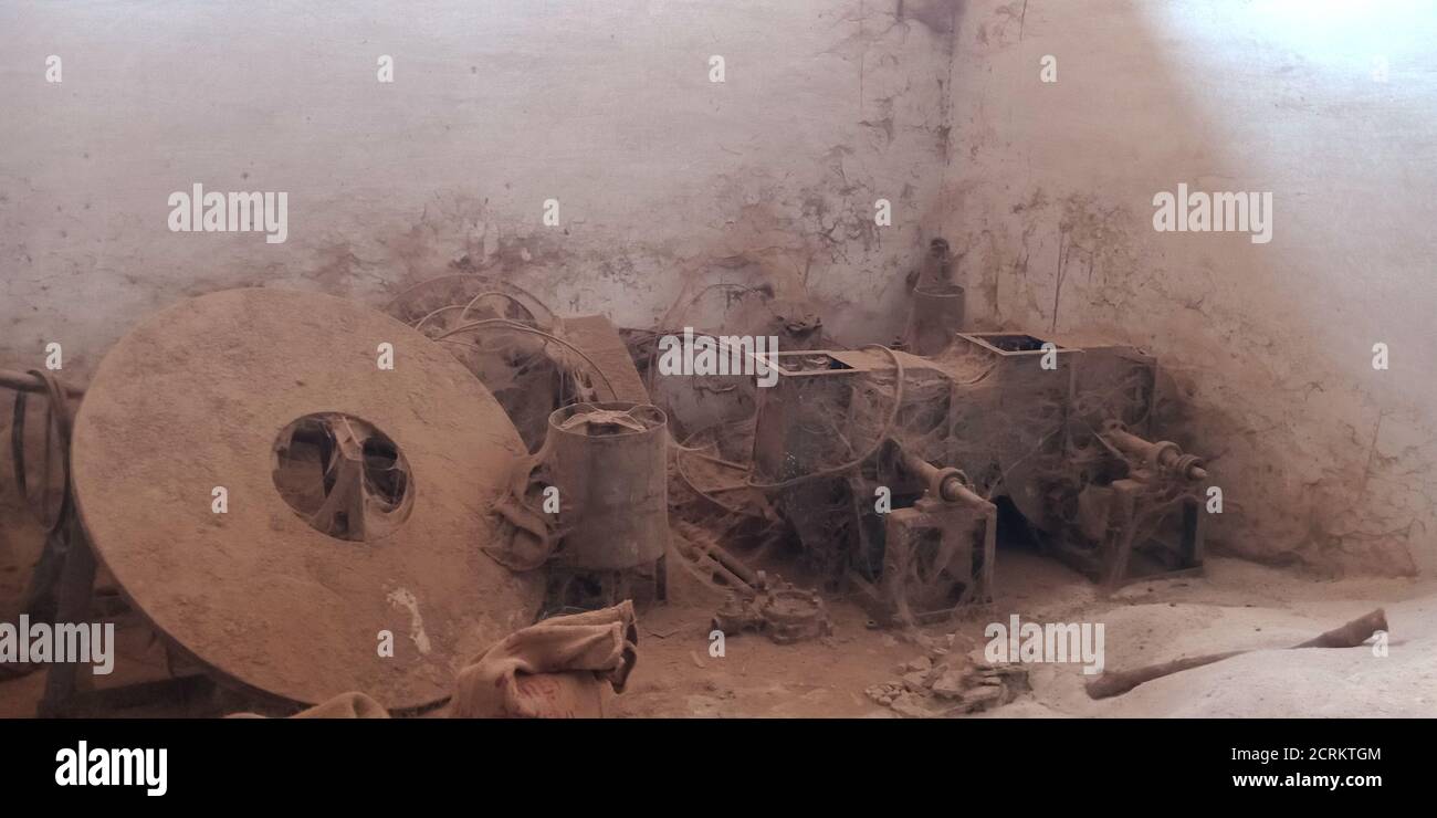 an old rusty rice mill machinery tool garbage exposed to the dusty ...