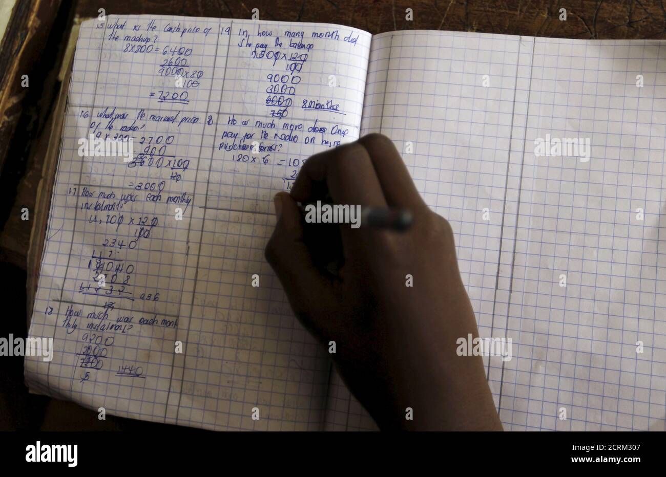 A pupil revises his class work without a teacher on the second week of a national teachers' strike, at Olympic Primary School in Kenya's capital Nairobi, September 9, 2015. The Kenya National Union of Teachers (KNUT) wants the Teachers Service Commission (TSC) to honour the 50-60 percent salary increment ordered by the Supreme Court in August, local media reported. REUTERS/Thomas Mukoya Stock Photo