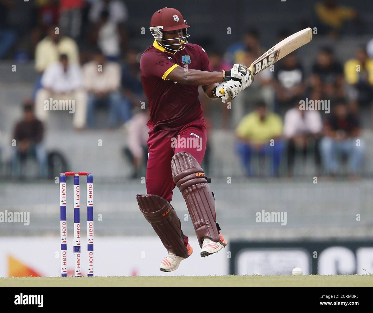 West Indies' Johnson Charles hits a boundary during their second One Day International cricket match against Sri Lanka in Colombo November 4, 2015. REUTERS/Dinuka Liyanawatte Stock Photo