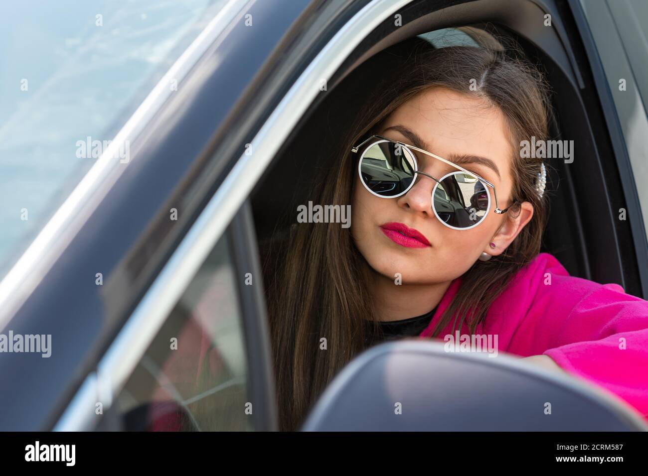 Woman wearing sunglasses driving car hi-res stock photography and images -  Alamy
