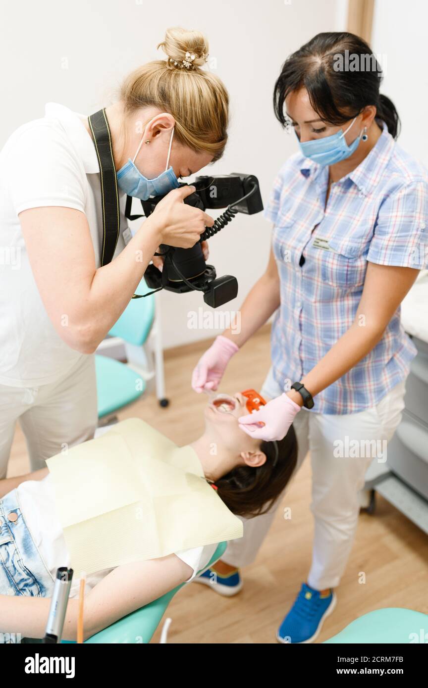 Female orthodontist, assistant and patient, clinic Stock Photo Alamy