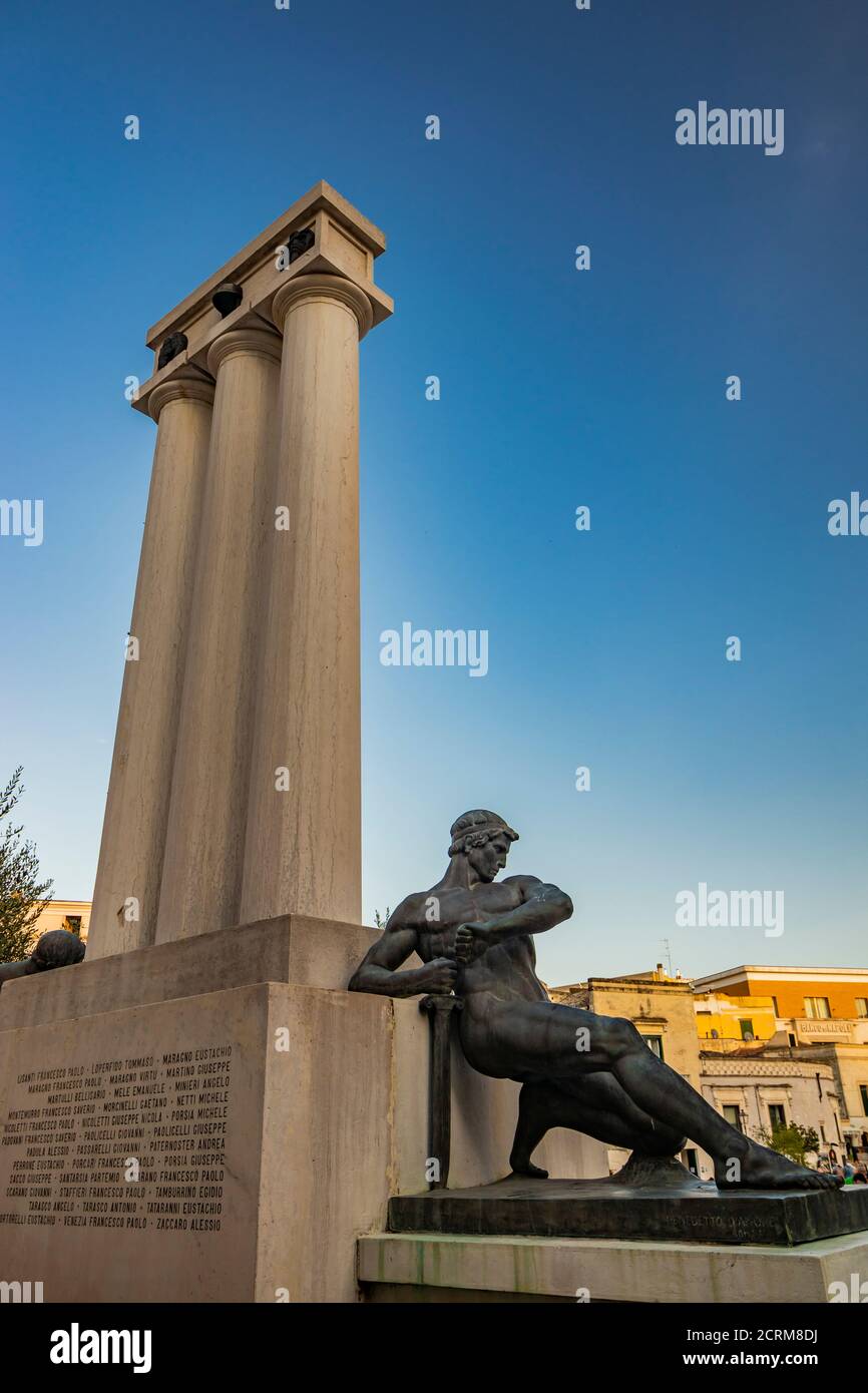 August 8, 2020 - Matera, Basilicata, Italy - The war memorial located in Piazza Vittorio Veneto. The blue sky on a summer evening. Stock Photo