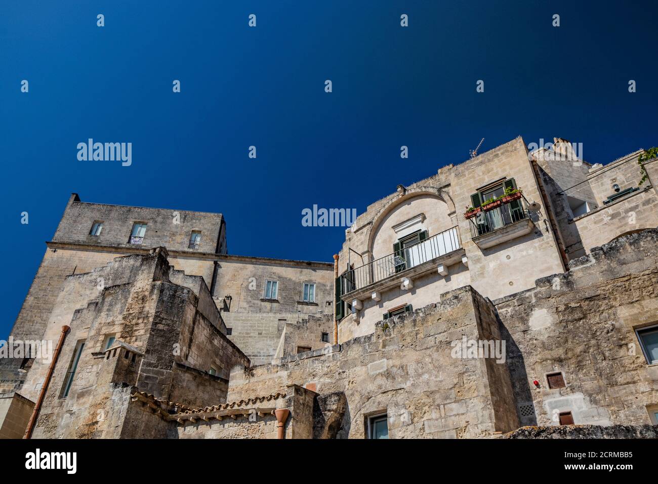 August 8, 2020 - Matera, Basilicata, Italy - The typical stone and brick houses of the old town of Matera, in the Sasso Caveoso. Stock Photo
