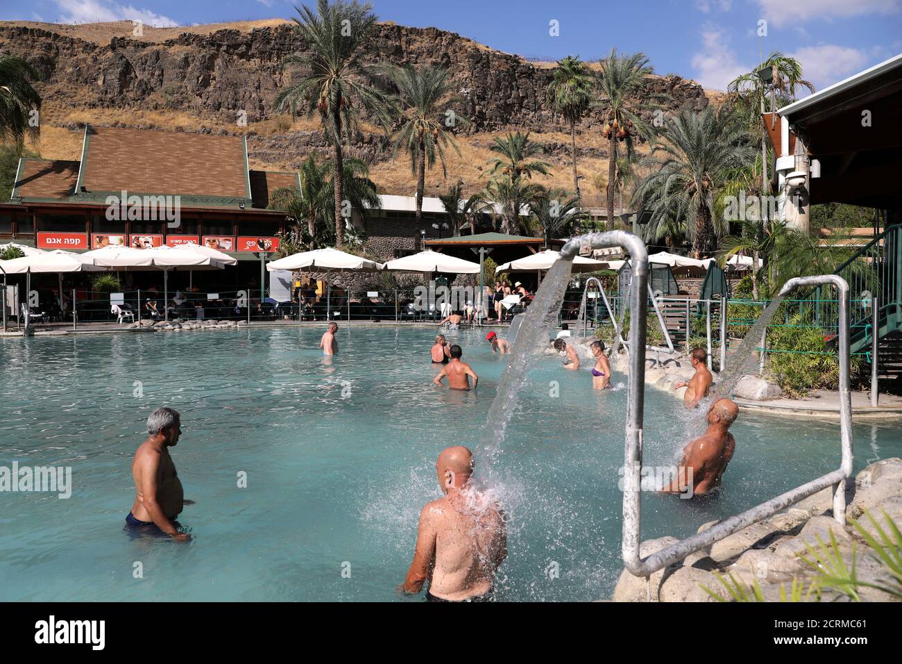 People Swim In Therapeutic Waters Of Hamat Gader Spa Tourist Complex In The Southern Part Of The