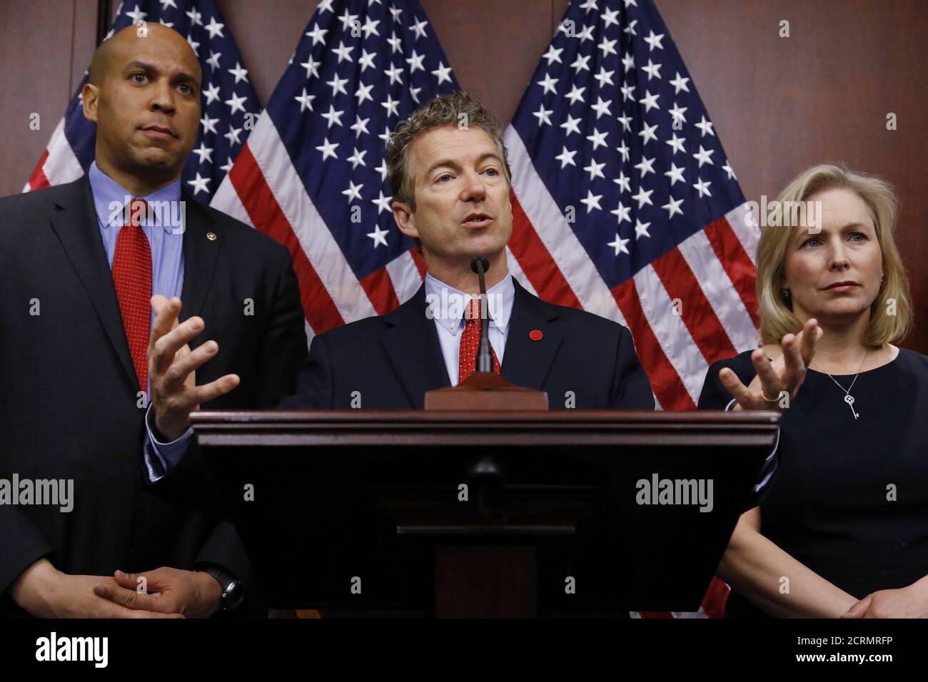 U.S. Senator Cory Booker (D-NJ) (L-R), Senator Rand Paul (R-KY), and Senator Kirsten Gillibrand (D-NY) hold a news conference, to introduce legislation that would prevent the federal government from prosecuting medical marijuana users in states where it is legal, at the U.S. Capitol in Washington, March 10, 2015.  REUTERS/Jonathan Ernst    (UNITED STATES - Tags: POLITICS HEALTH SOCIETY) Stock Photo