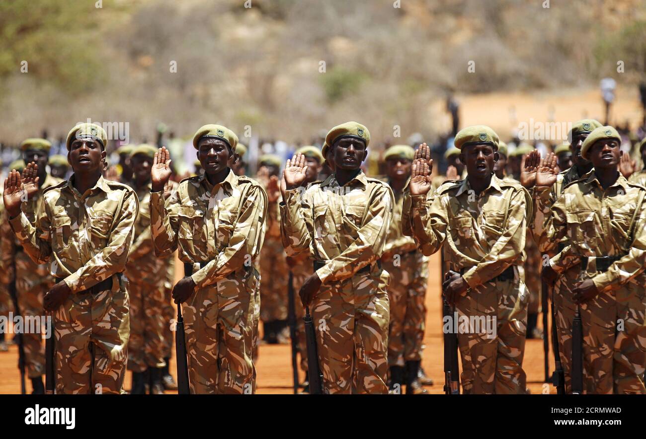 Kenya Wildlife Services (KWS) rangers take Oath of Allegiance during the passing out parade for 592 rangers at the Law Enforcement Academy Manyani in Tsavo West National Park, October 27, 2015. Kenya Wildlife Services Law Enforcement Academy conducts training programs for uniformed personnel including general security courses for staff from institutions outside the wildlife conservation fraternity especially to combat poaching, KWS officials said. Poaching has surged in the last few years across sub-Saharan Africa, where gangs kill elephants and rhinos to feed Asian demand for ivory and horns  Stock Photo