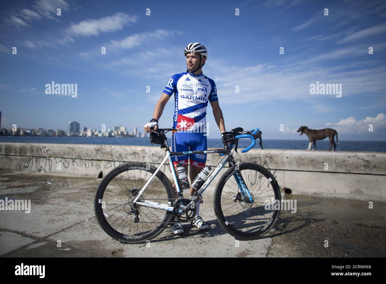 Austrian Cyclist Jacob Zurl, who will try to mark a world record of non stop riding of 1400 Km between Faro de Punta de Maisi on the East side of Cuba to Cabo de San Antonio on the West side of the island, waits for an interview at the sea front Malecon in Havana, December 9, 2015. REUTERS/Alexandre Meneghini Stock Photo