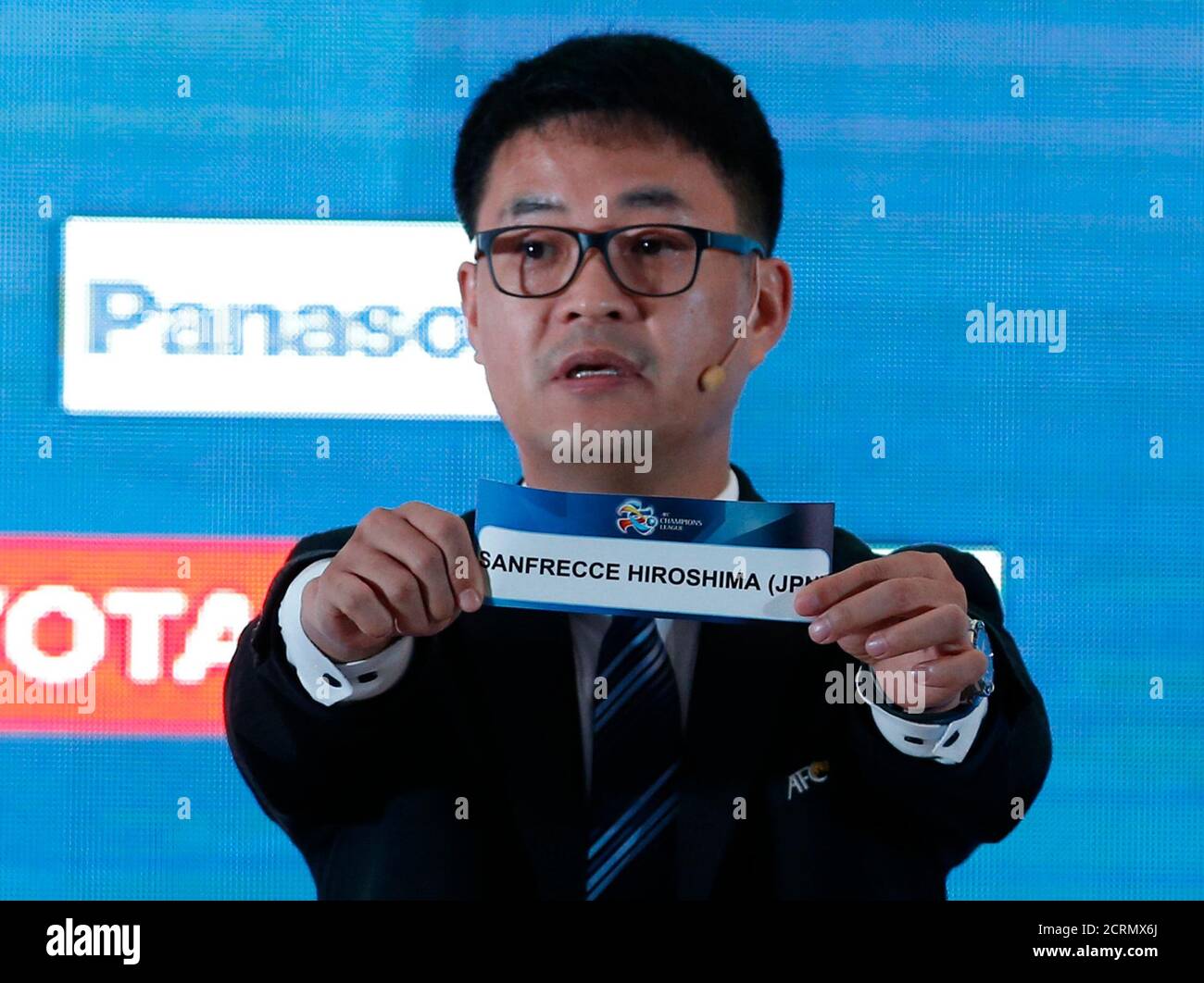 An Official Holds Up The Slip Showing Japan S Sanfrecce Hiroshima Football Club During The Draw Of The 16 Asian Football Confederation Afc Champions League Group Stage In Kuala Lumpur Malaysia December 10