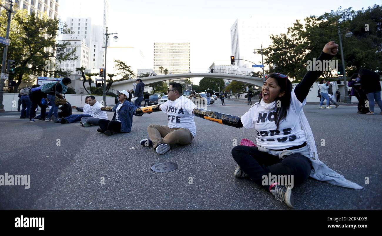 People block an intersection as they gather outside a Federal Building while protesting against Immigration and Customs Enforcement (ICE) raids on Central American refugees in Los Angeles, California January 26, 2016.   REUTERS/Mario Anzuoni Stock Photo