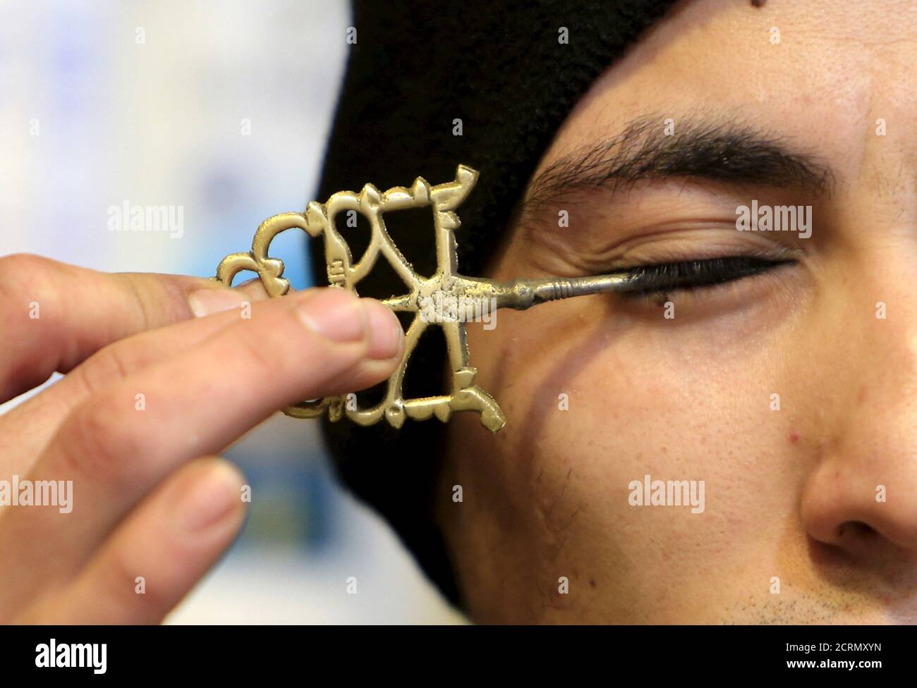 Nasser Abu al-Kal applies traditional kohl eyeliner in the port city of  Sidon, southern Lebanon January 19, 2016. Many Muslim men get their eyes  smeared with traditional Kohl eyeliner for religious reason.