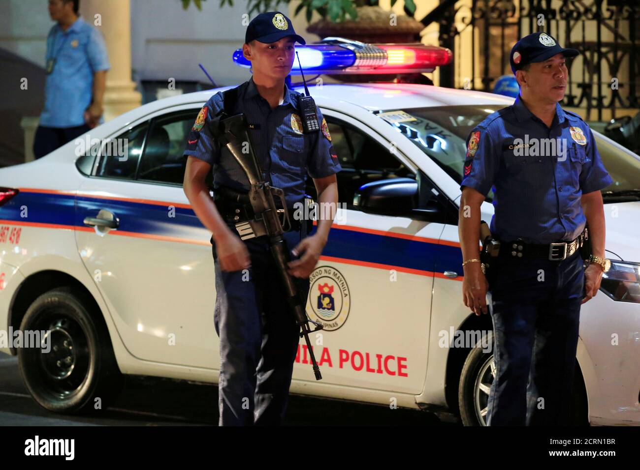 Members of the Philippine National Police (PNP) stand guard beside their  mobile patrol along a main street of metro Manila in the Philippines May  12, 2016. REUTERS/Romeo Ranoco Stock Photo - Alamy