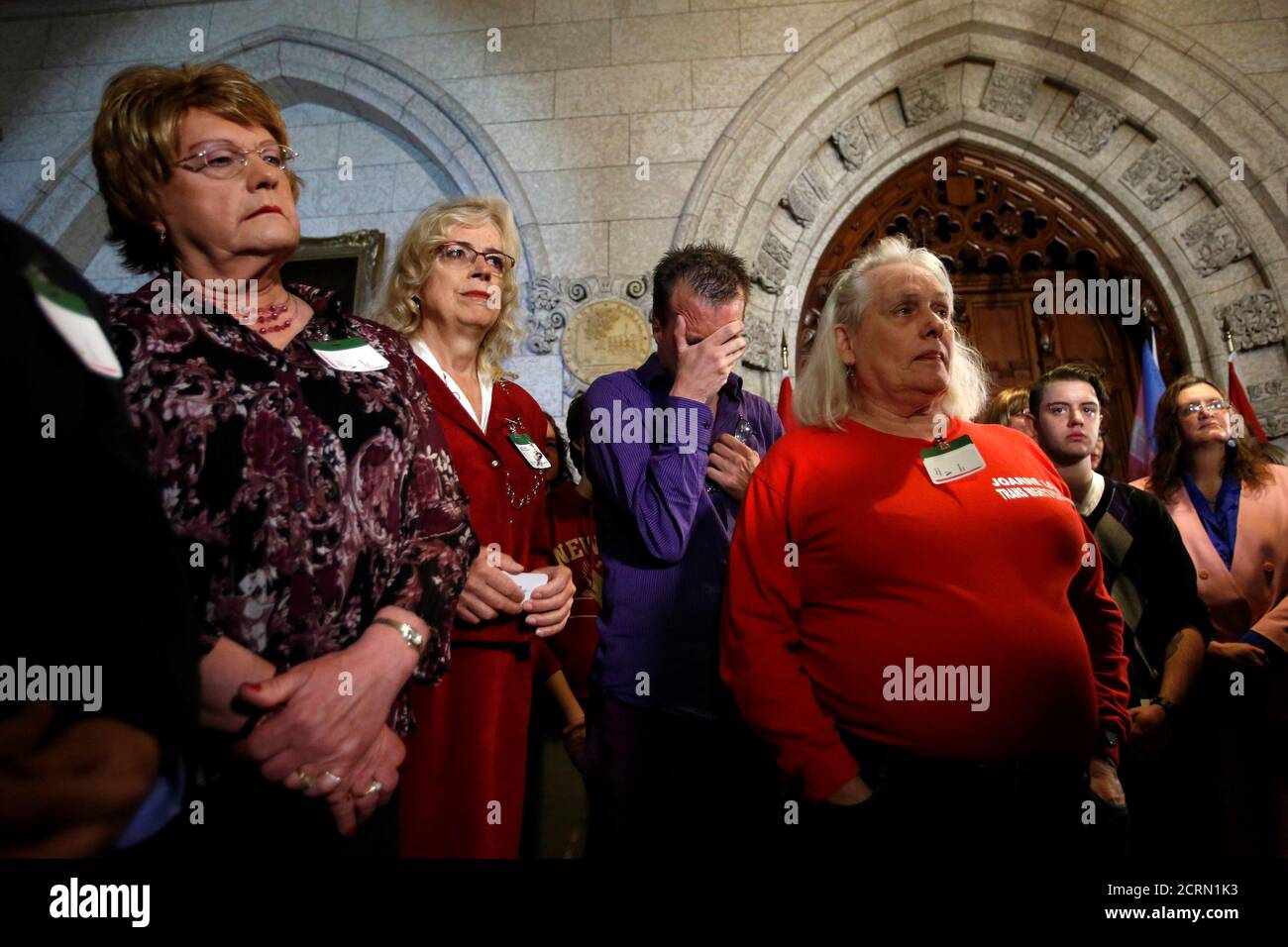 Supporters of the transgender community listen during a news conference announcing that Canada will introduce legislation to protect transgender people from discrimination and hate crimes, on Parliament Hill in Ottawa, Canada, May 17, 2016. REUTERS/Chris Wattie Stock Photo