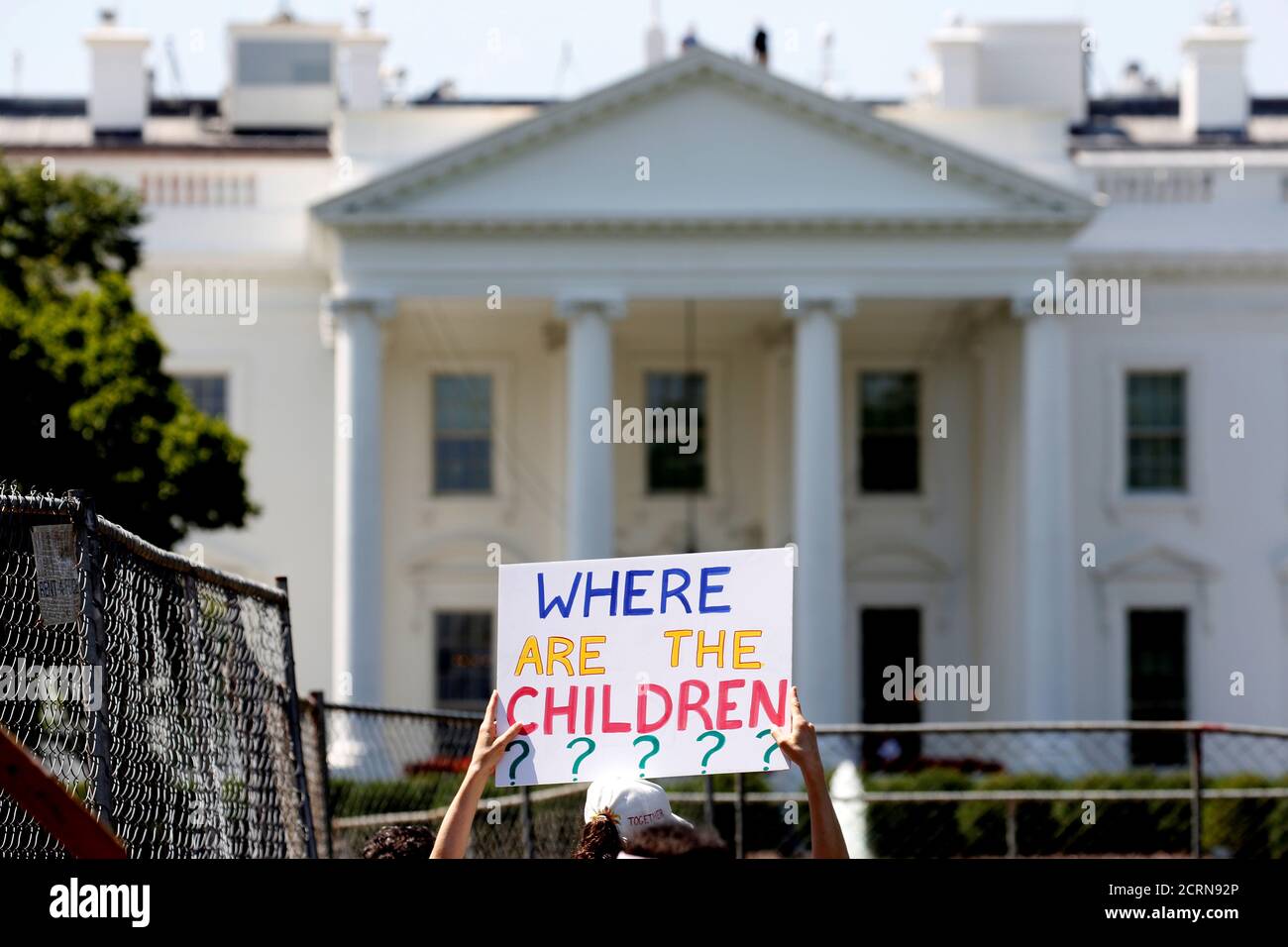 An immigration activists hold signs against family separation during a rally to protest against the Trump Administration's immigration policy outside the White House in Washington, U.S., June 30, 2018. REUTERS/Joshua Roberts Stock Photo