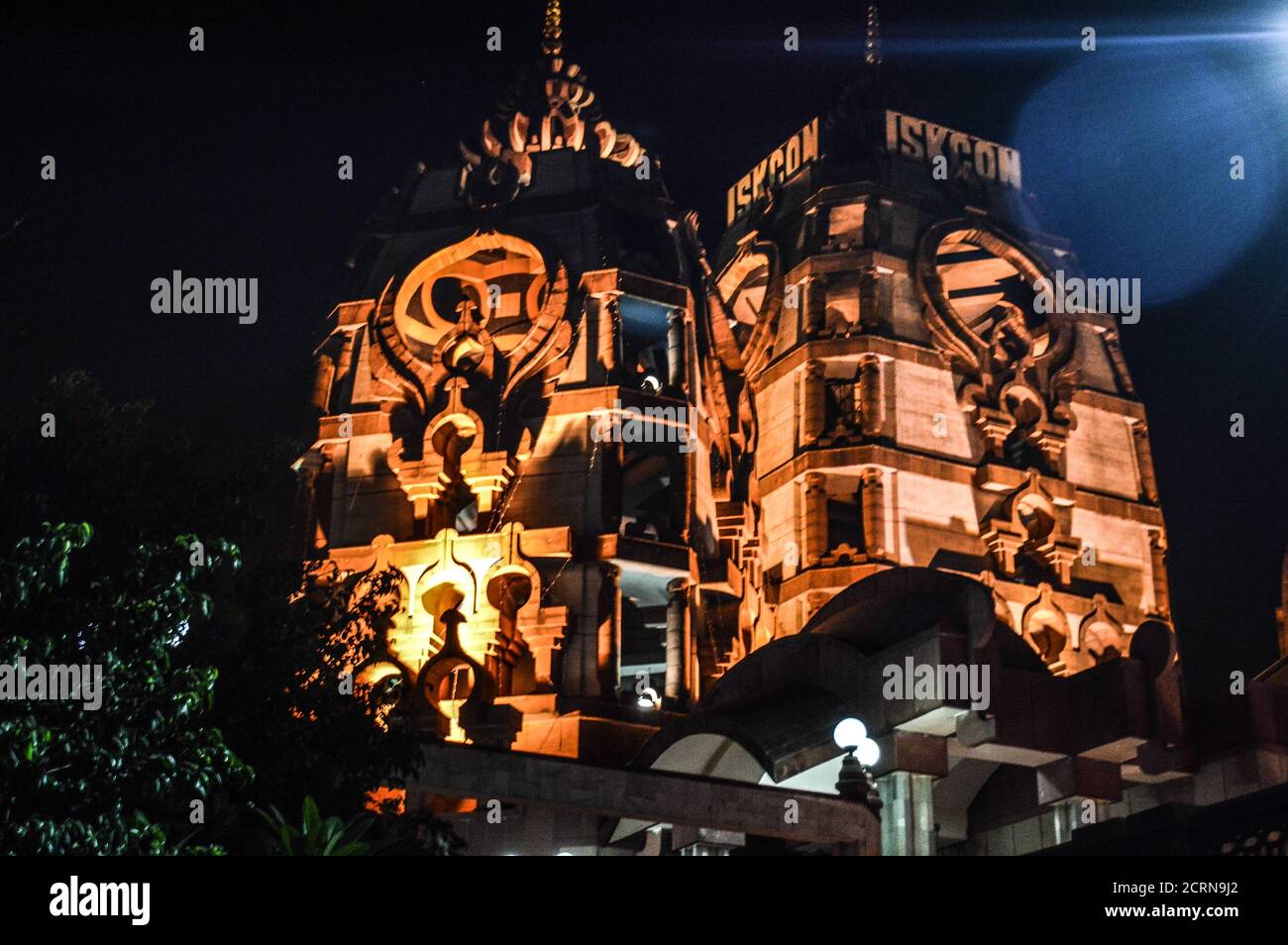Iskcon temple of new delhi india lit up with light at evening Stock Photo