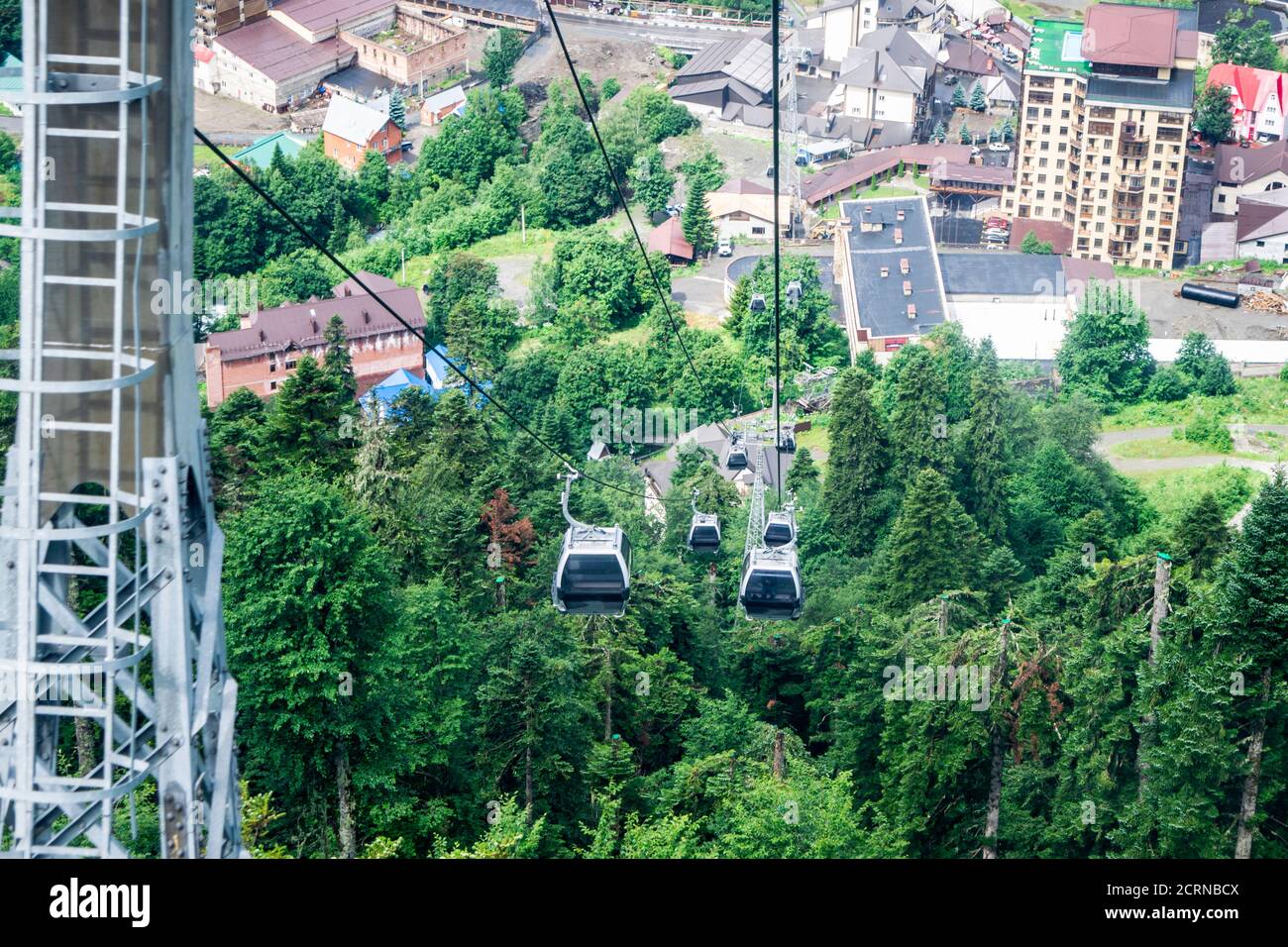cable car on a mountain slope cable cars running up and down Stock Photo