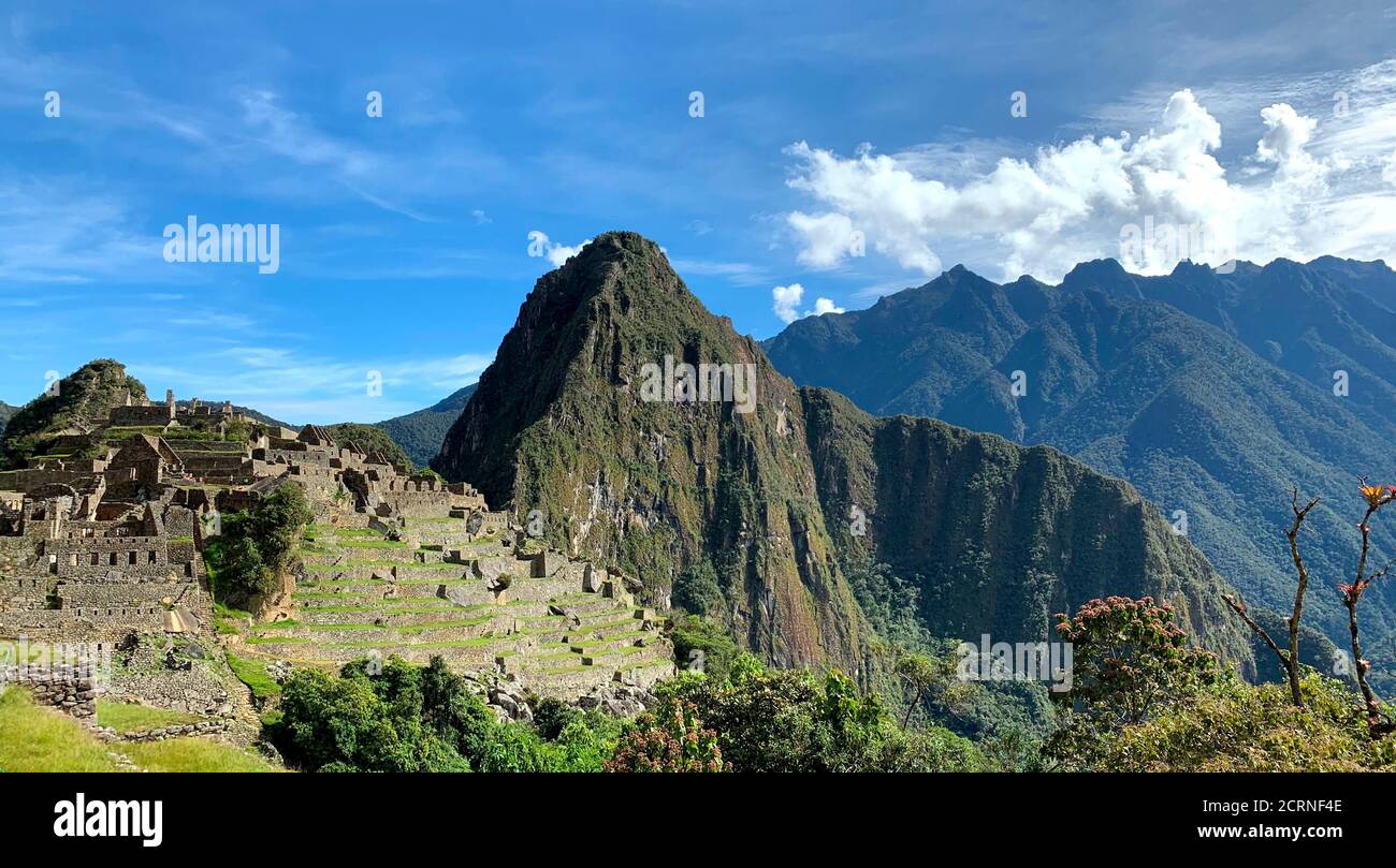 Scenic panorama Machu Picchu. Famous historical landmark in Peru. Andes mountains. Huayna Picchu. Ancient city of Inca Empire. Impressive architecture Stock Photo