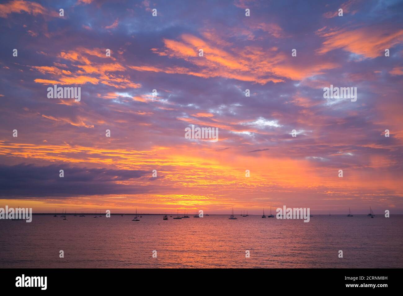 Moored sailing boats and yachts, in Darwin Harbour at sunset. Darwin, Northern Territory, Australia. Stock Photo