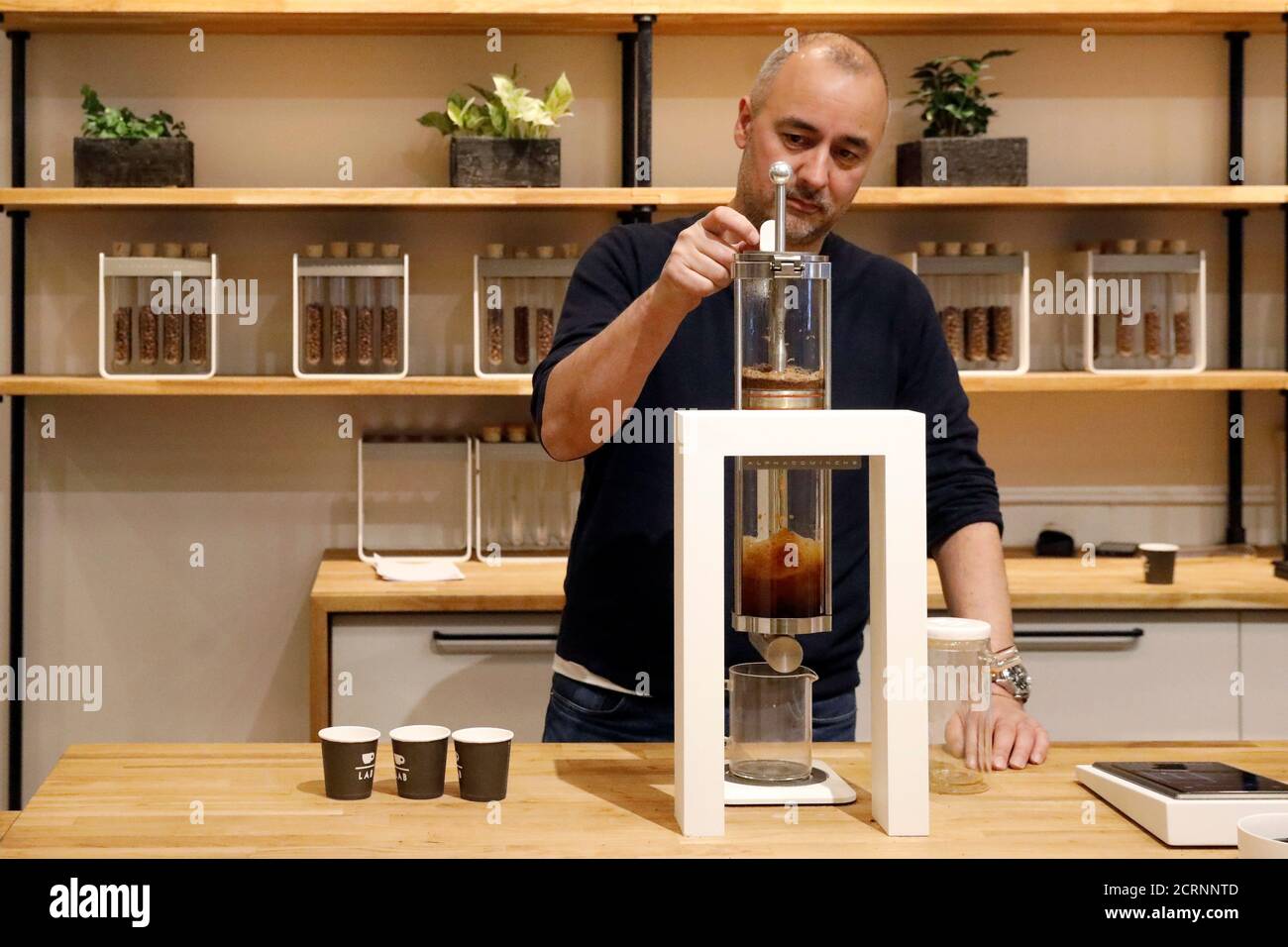 Alpha Dominche Chief Executive Officer Thomas Perez brews a serving of Kenyan Geisha coffee, which retails at $18 per cup, at his company's Extraction Lab in Brooklyn, New York, U.S., February 17, 2017. REUTERS/Brendan McDermid Stock Photo