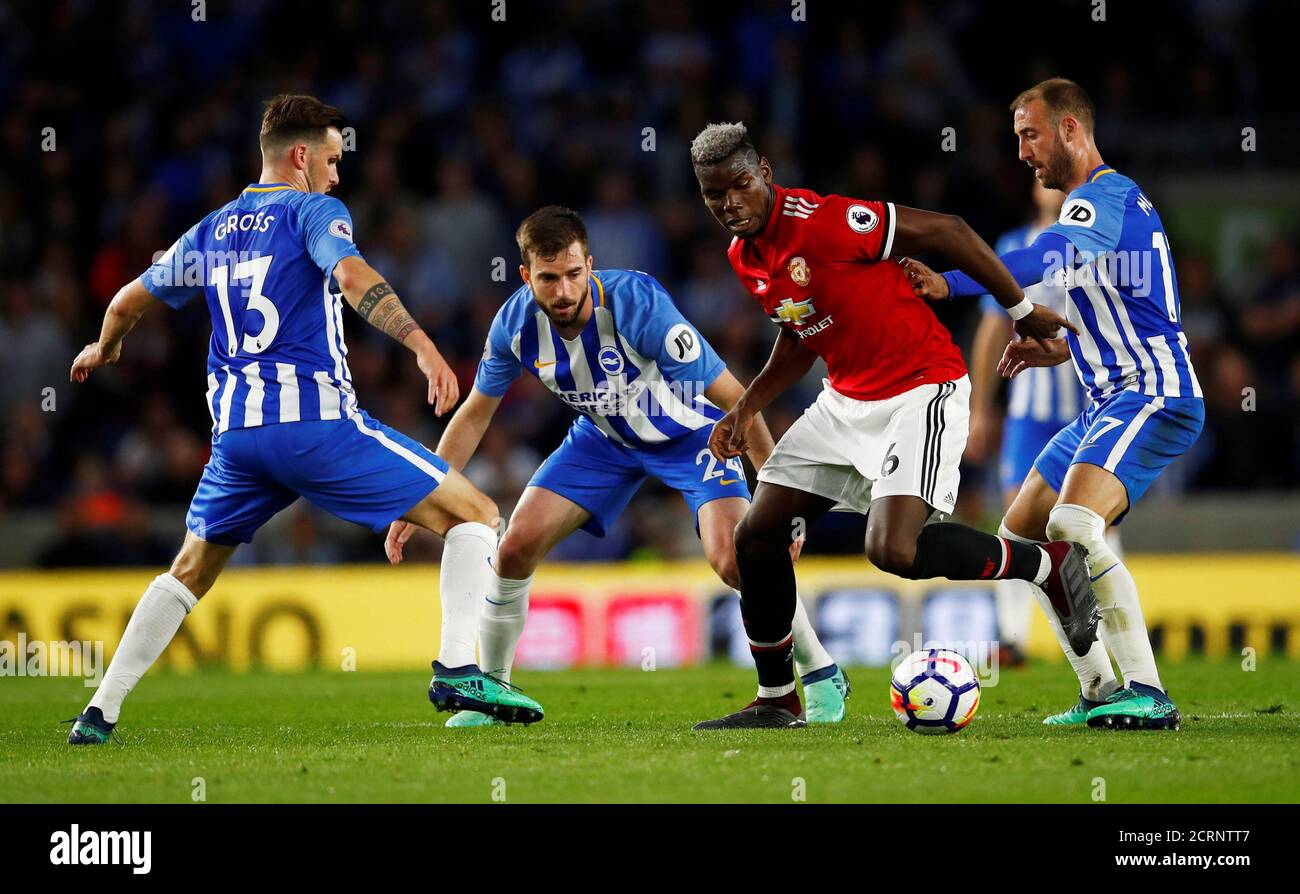 Soccer Football - Premier League - Brighton & Hove Albion v Manchester United - The American Express Community Stadium, Brighton, Britain - May 4, 2018   Manchester United's Paul Pogba in action with Brighton's Glenn Murray, Davy Propper and Pascal Gross    REUTERS/Eddie Keogh    EDITORIAL USE ONLY. No use with unauthorized audio, video, data, fixture lists, club/league logos or 'live' services. Online in-match use limited to 75 images, no video emulation. No use in betting, games or single club/league/player publications.  Please contact your account representative for further details. Stock Photo