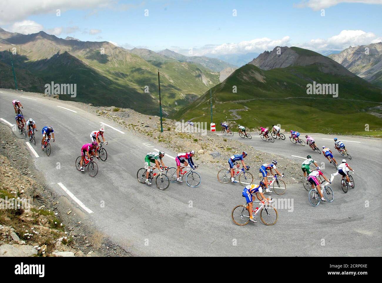 The pack of riders passes through the French Alps mountains during the  179,5km sixteenth stage of the 89th Tour de France cycling race from Les  Deux Alpes to La Plagne July 24,