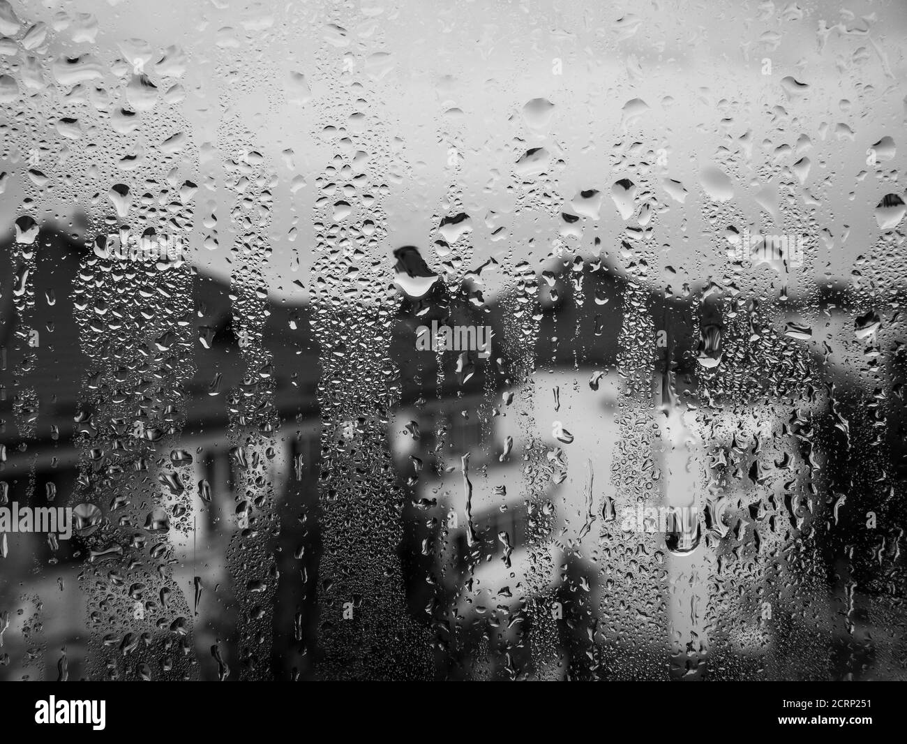 Water drops on the glass window on a rainy day Stock Photo - Alamy