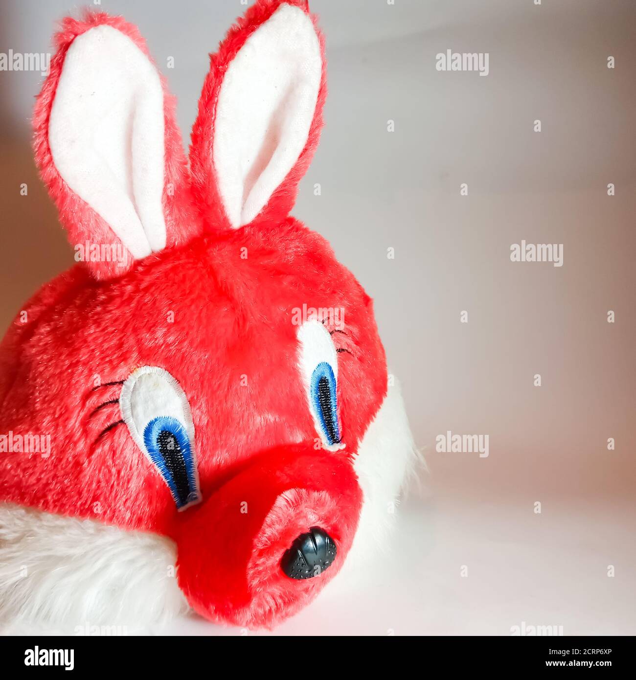 Pink rabbit face cartoon toy isolated on white background for marketing ...