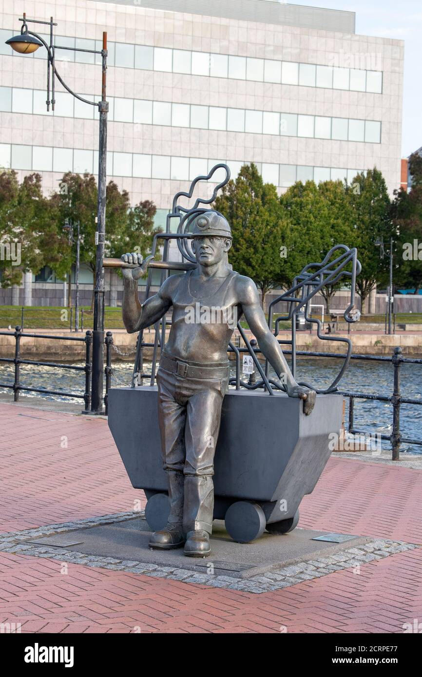 From Pit to Port, bronze statue of a Welsh coal miner, by John Clinch, Cardiff Bay, Cardiff, Wales, United Kingdom. Stock Photo