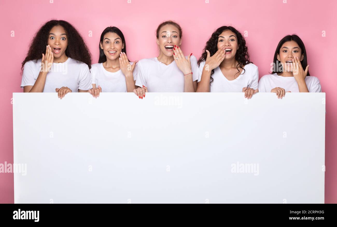 Excited Multiethnic Ladies Holding Poster With Copy Space, Pink ...