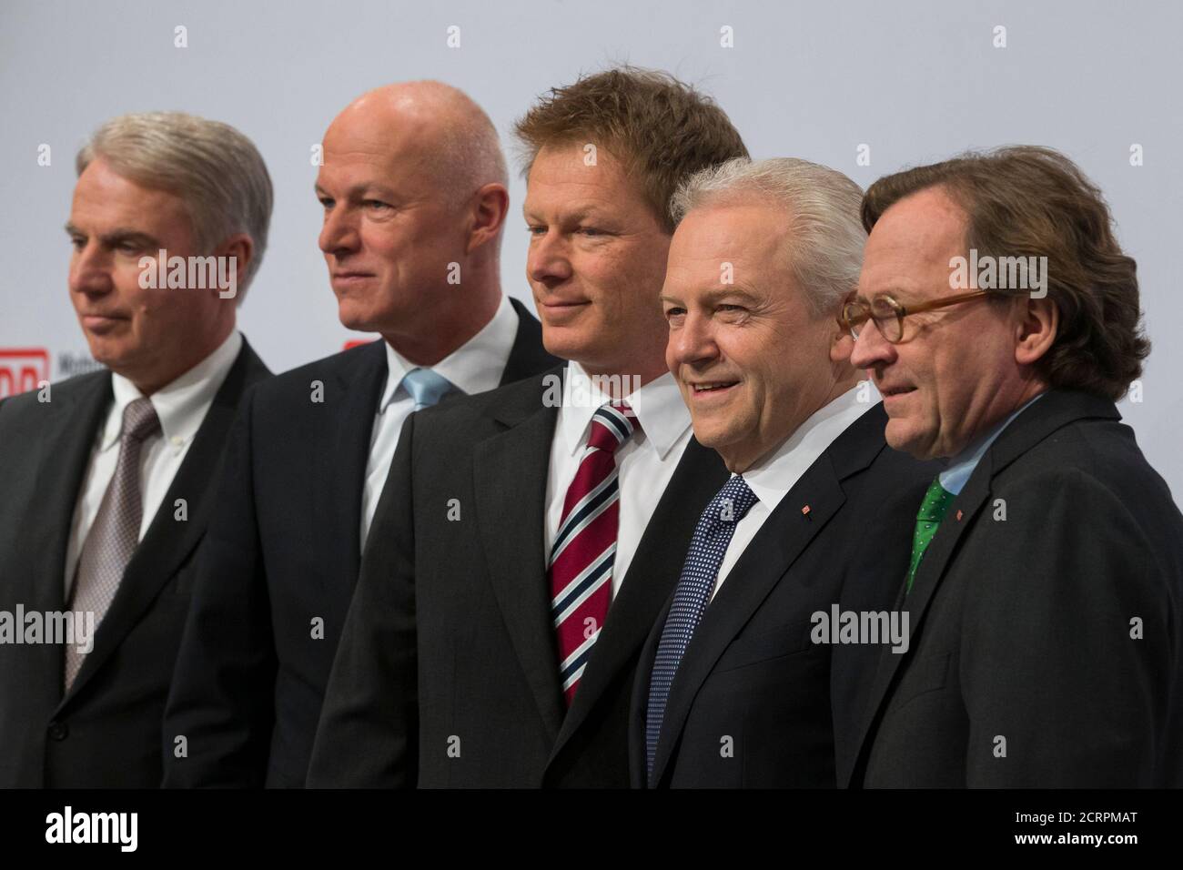 Chief Executive Officer of the German railway firm Deutsche Bahn Ruediger Grube (2nd R) poses with members of the board before an annual results news conference in Berlin March 21, 2013. Pictured are (R-L) Chief of human resources Ulrich Weber, chief of finance and controlling Richard Lutz, chief of passenger traffic Ulrich Homburg and chief of compliance and security Gerd Becht.   REUTERS/Thomas Peter (GERMANY  - Tags: BUSINESS TRANSPORT) Stock Photo