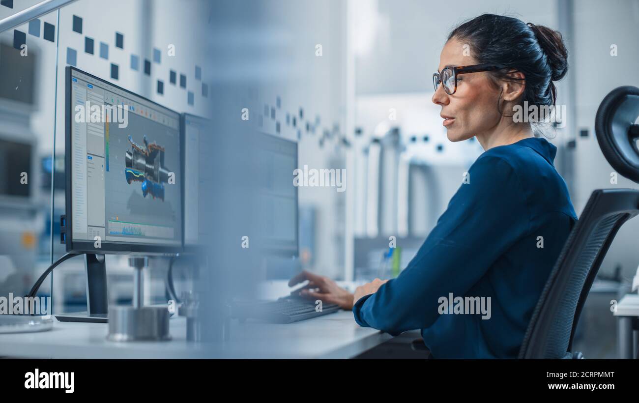 Industrial Female Engineer Working on a Personal Computer, Two Monitor