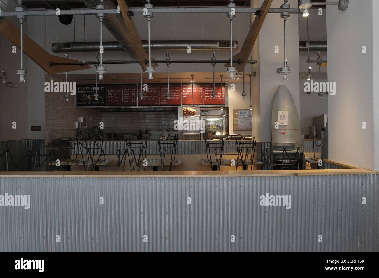 The inside of an empty Chipotle Mexican Grill is seen through the window during the normally busy lunch rush in New York February 8, 2016. REUTERS/Brendan McDermid Stock Photo