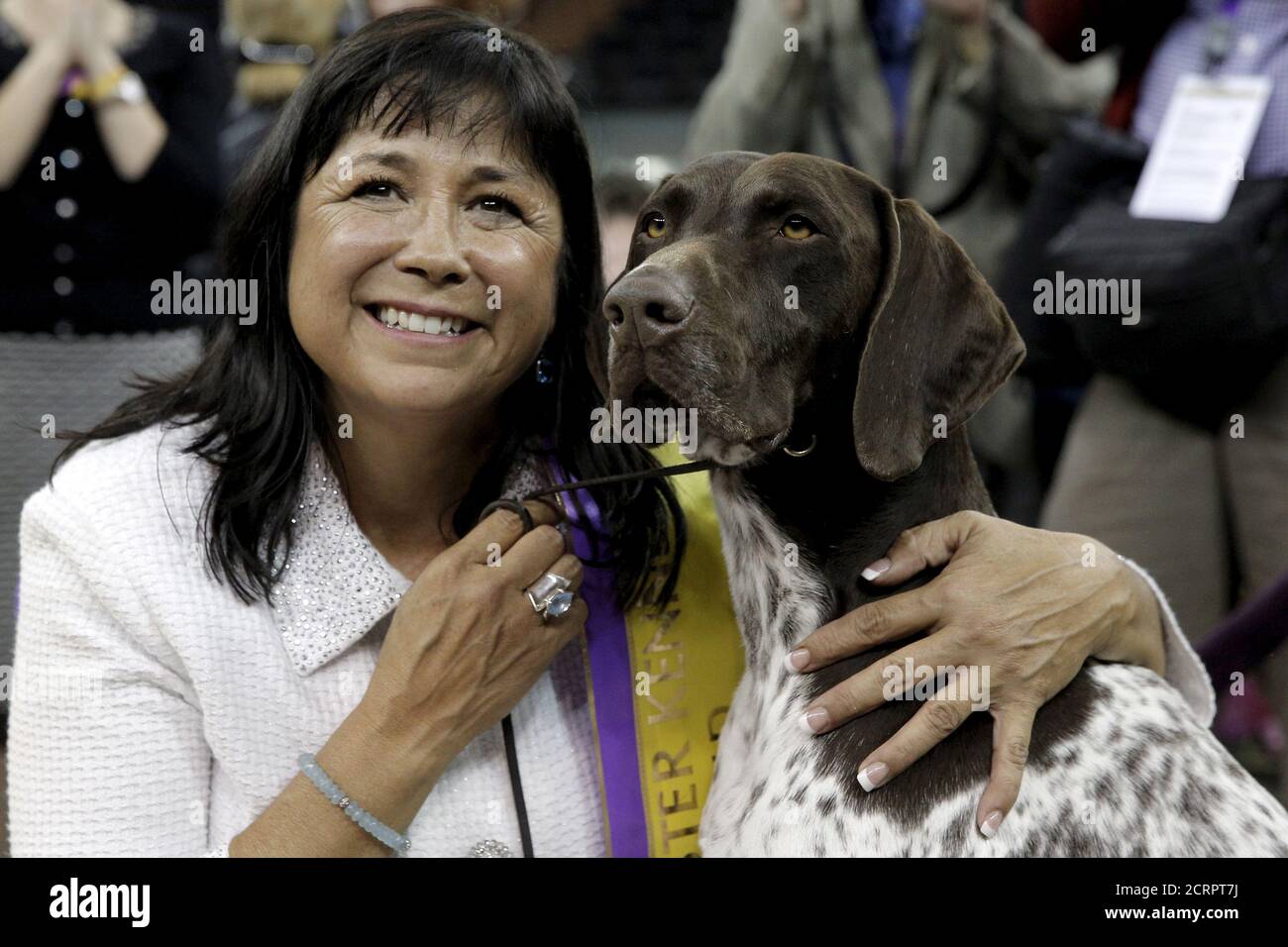 Handler Valerie Nunez Atkinson poses with CJ, a German Shorthaired Pointer from the Sporting Group, after they won Best in Show at the Westminster Kennel Club Dog show at Madison Square Garden in New York February 16, 2016. REUTERS/Brendan McDermid Stock Photo