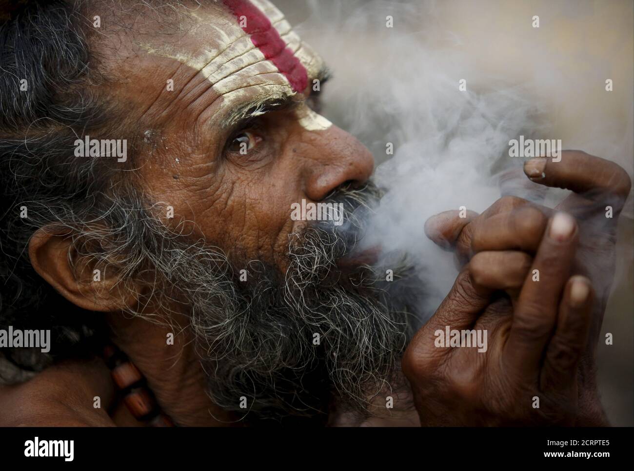 A Hindu Holy Man Or Sadhu Smokes Marijuana In A Chillum On The Premises Of Pashupatinath Temple In Kathmandu Nepal March 6 2016 Hindu Holy Men From Nepal And India Come To