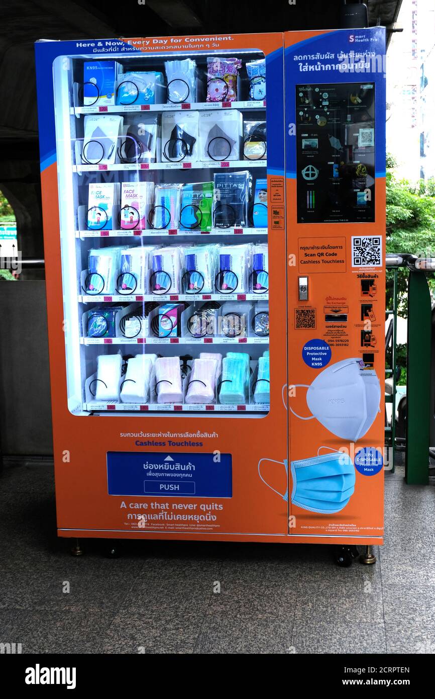 Touchless, cashless masks dispensing machine. BTS Phra Khanong station, Bangkok, Thailand. Stock Photo