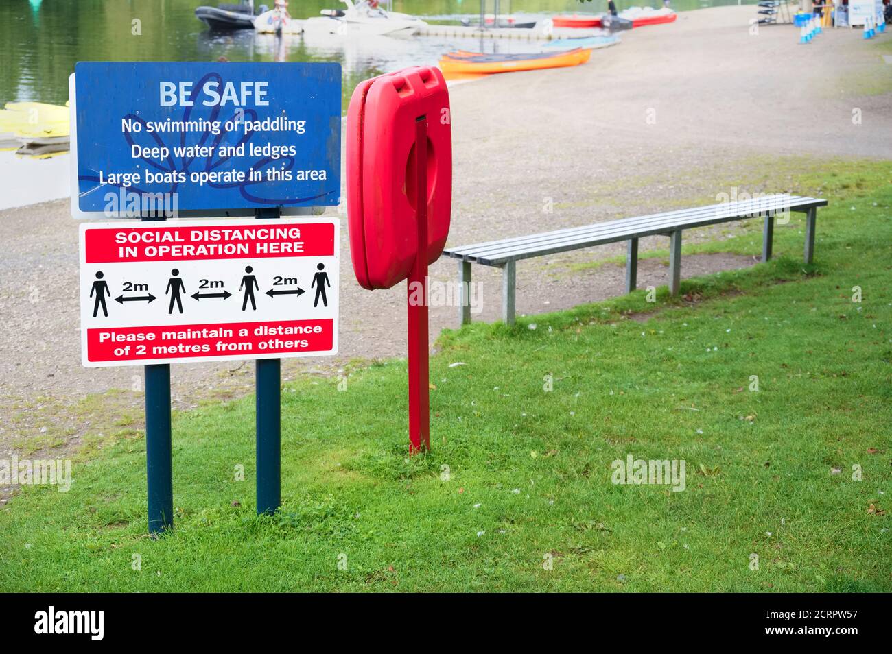 Social distancing sign at outdoor water sport facility Stock Photo
