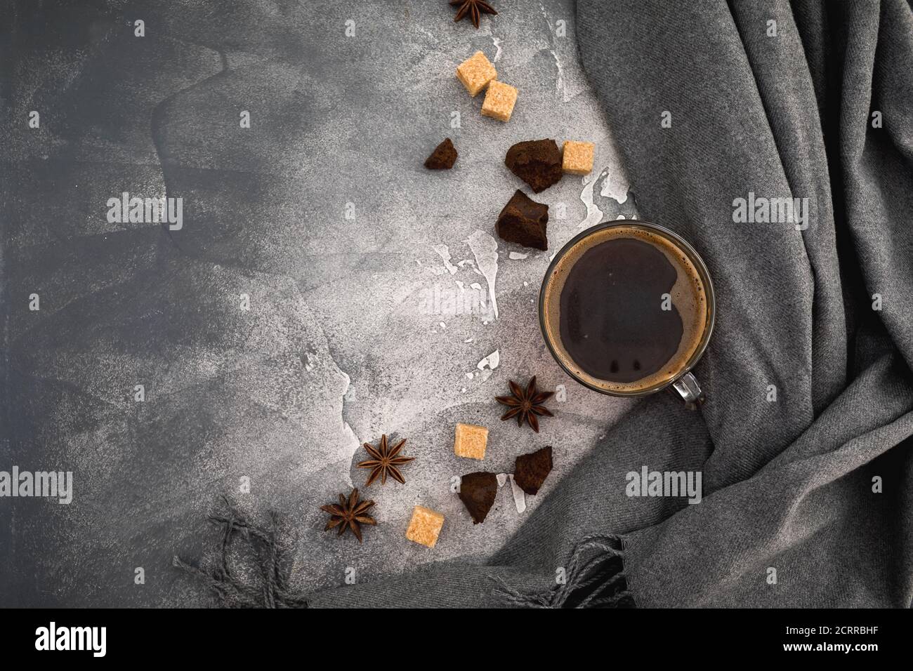 Composition with coffee cup, sugar and dark chocolate on gray background. Flat lay, top view Stock Photo