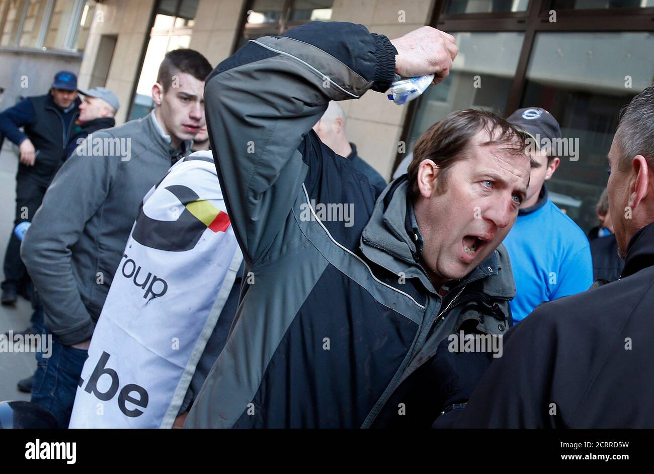 A farmers argues with a plainclothes policeman during a demonstration outside the EU headquarters in Brussels, Belgium, March 14, 2016.     REUTERS/Francois Lenoir Stock Photo